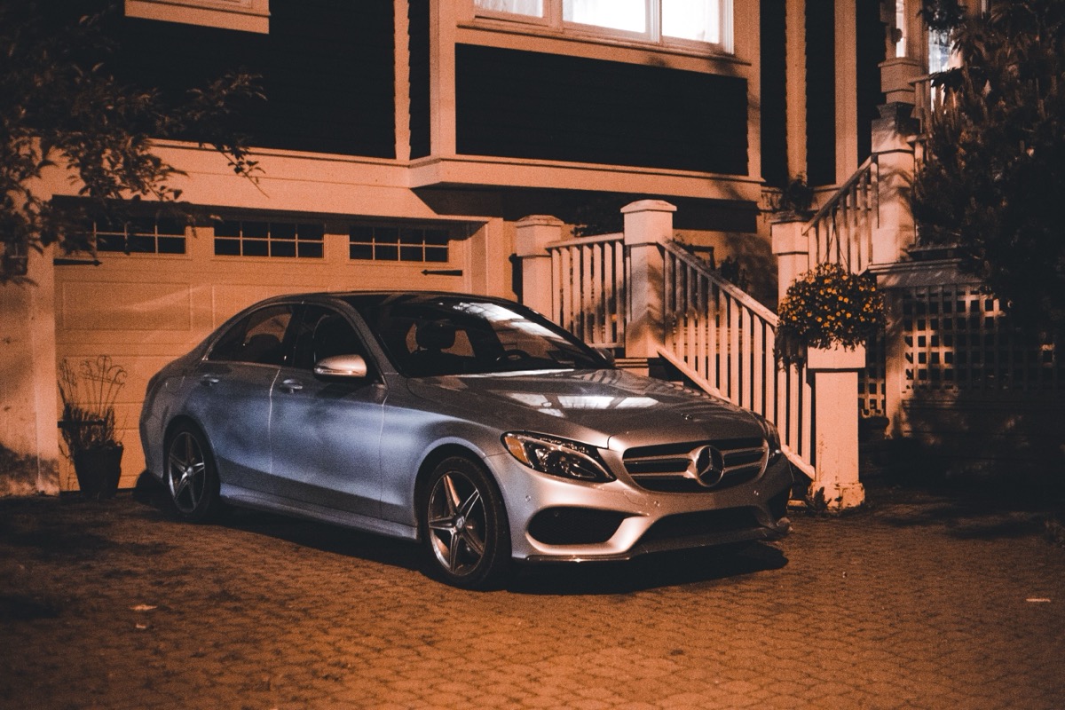 Modern keyless car parked on a suburban driveway at night, a typical target for relay theft in the North East