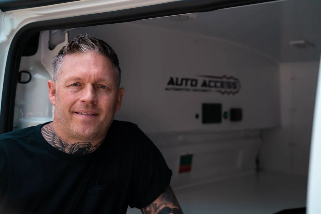 Kevin from Auto Access Automotive Locksmith standing beside his fully equipped mobile workshop